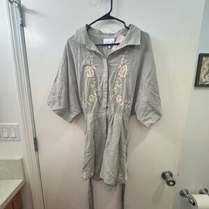 Sage green romper with collar and white embroidery